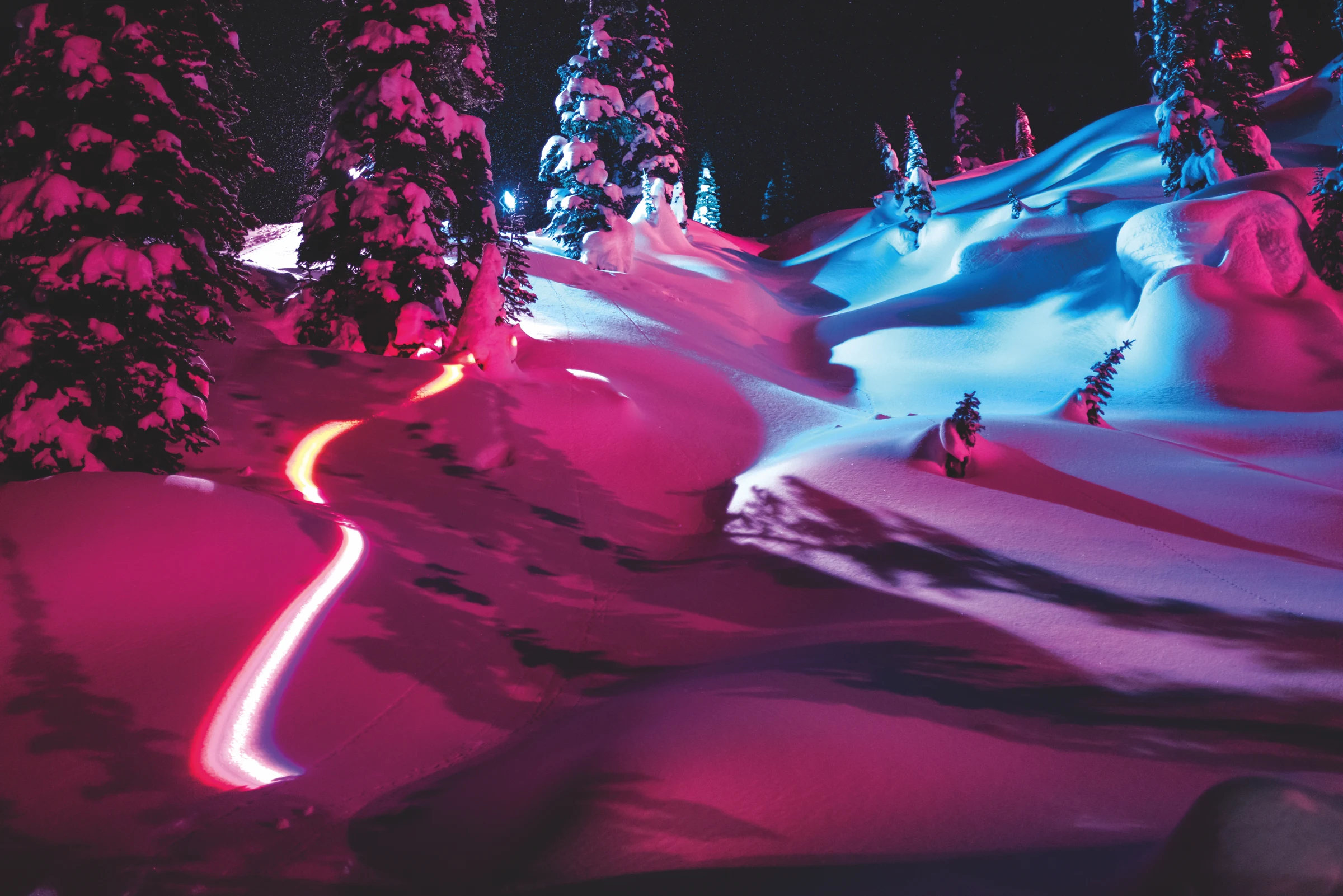 Nighttime mountain landscape illuminated in pink and blue from Mountains of the Moon. Photo: Pondella.